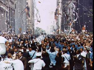 picture of an old-fashined ticker tape parade in New York